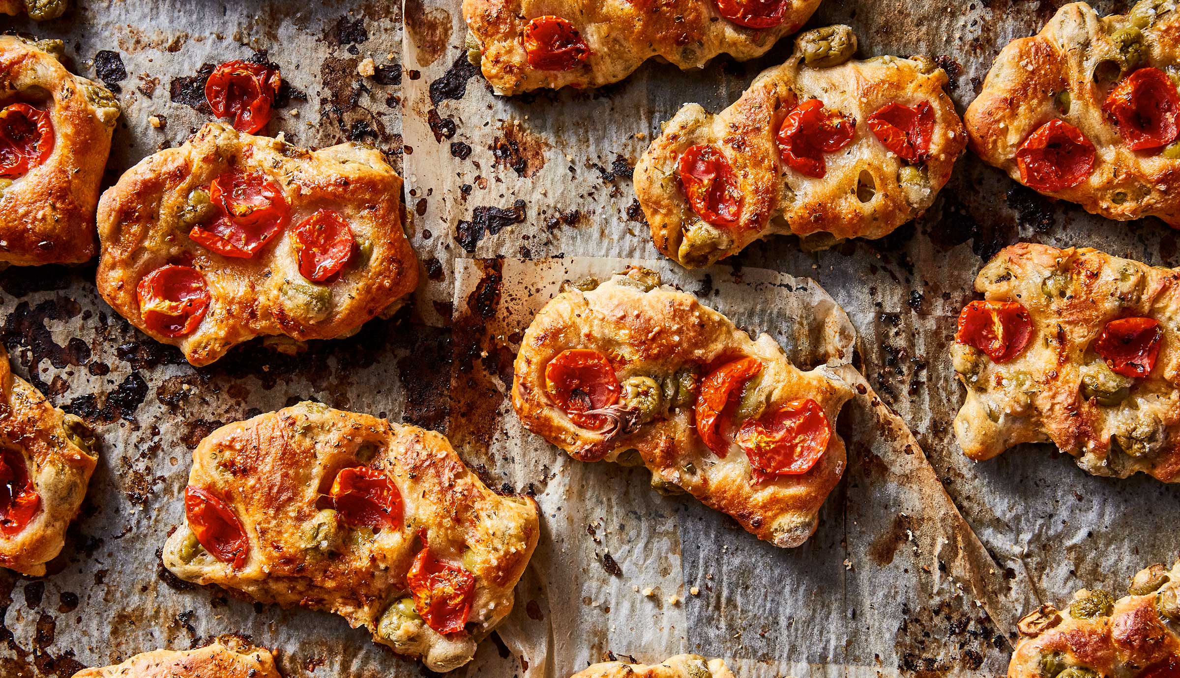 Baked bread with roasted tomatoes and olives