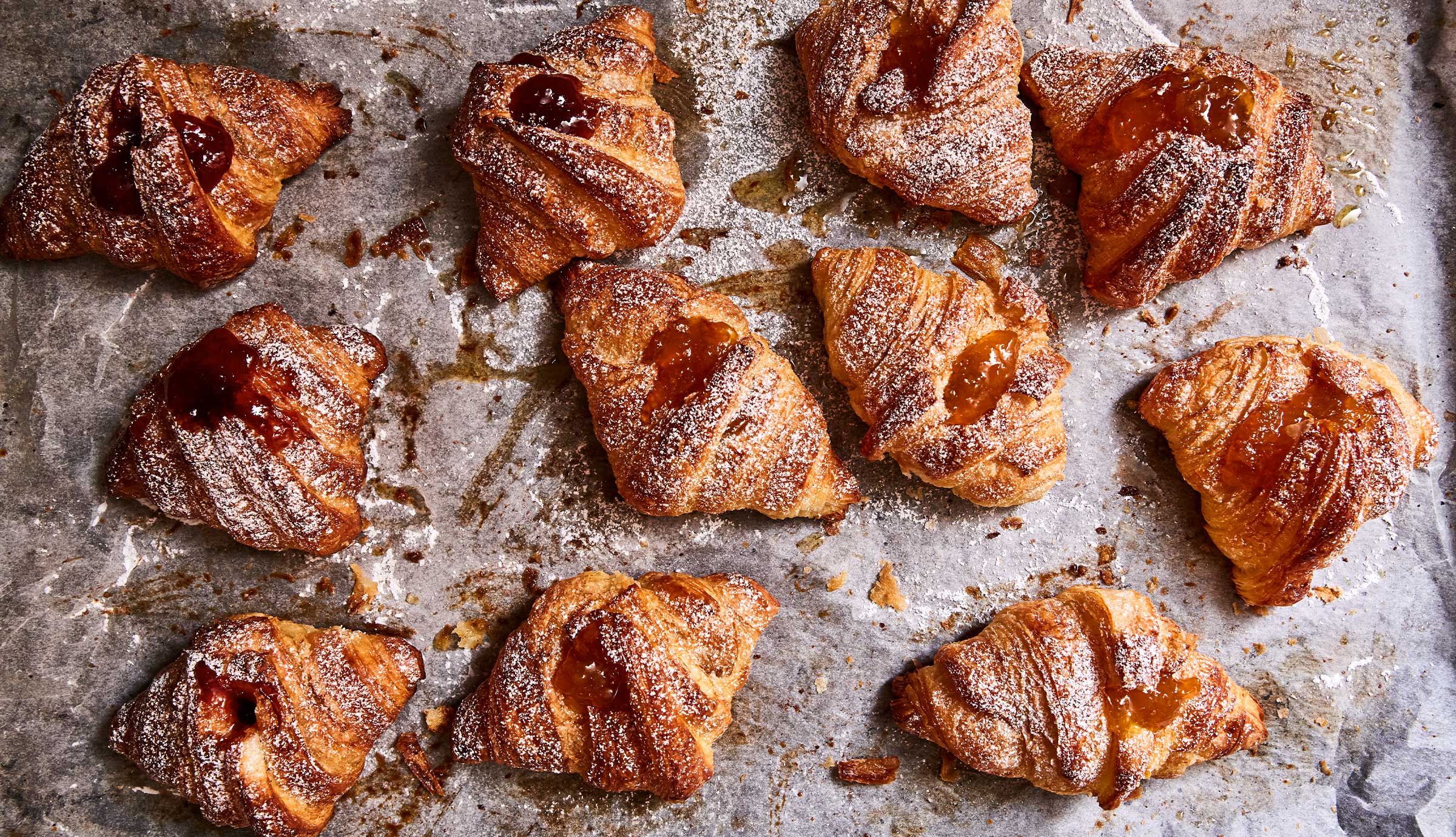 Baked pastry with jam with sugar sprinkled on top