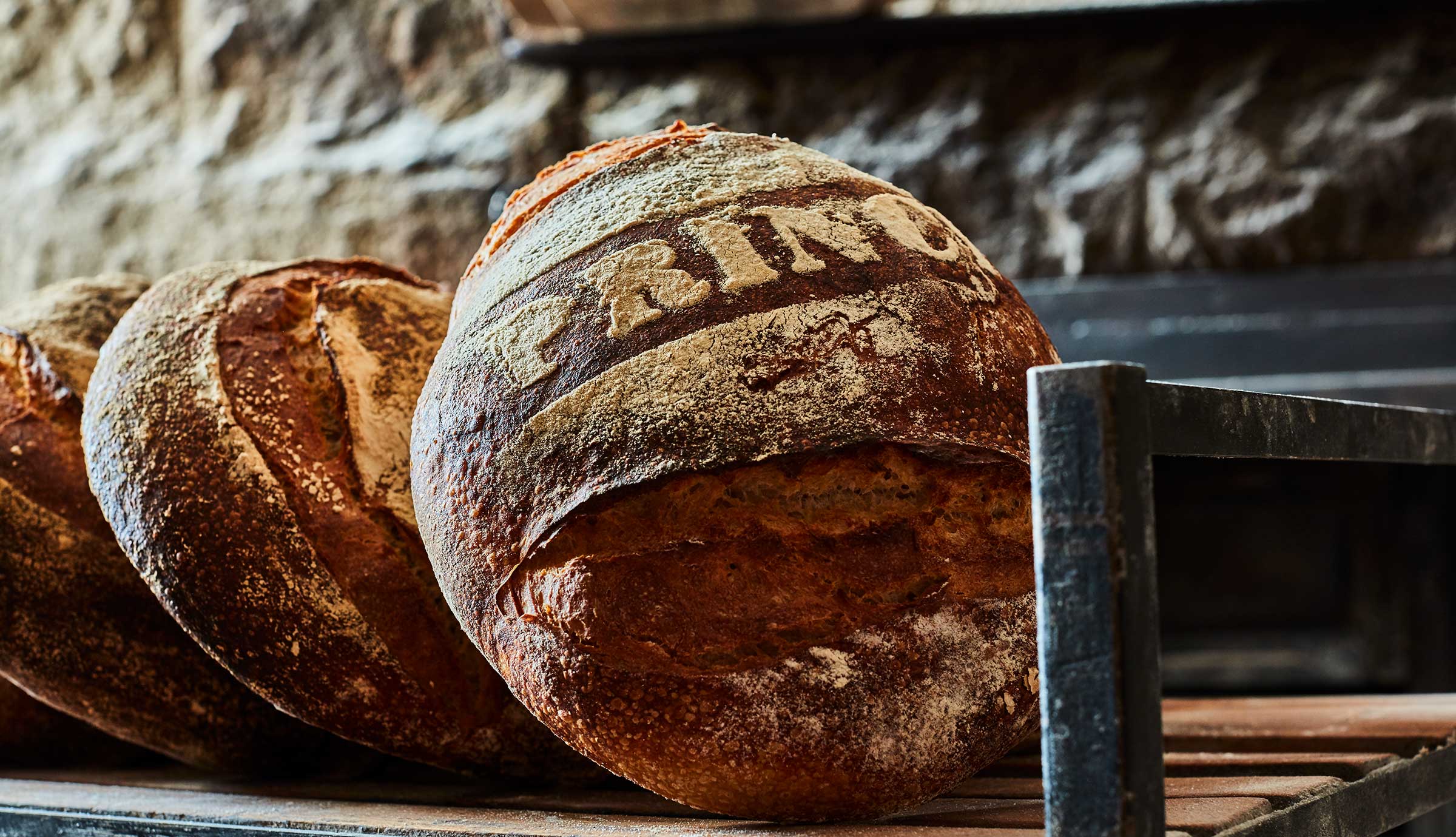 Baked bread loaf with the word Princi written in flour
